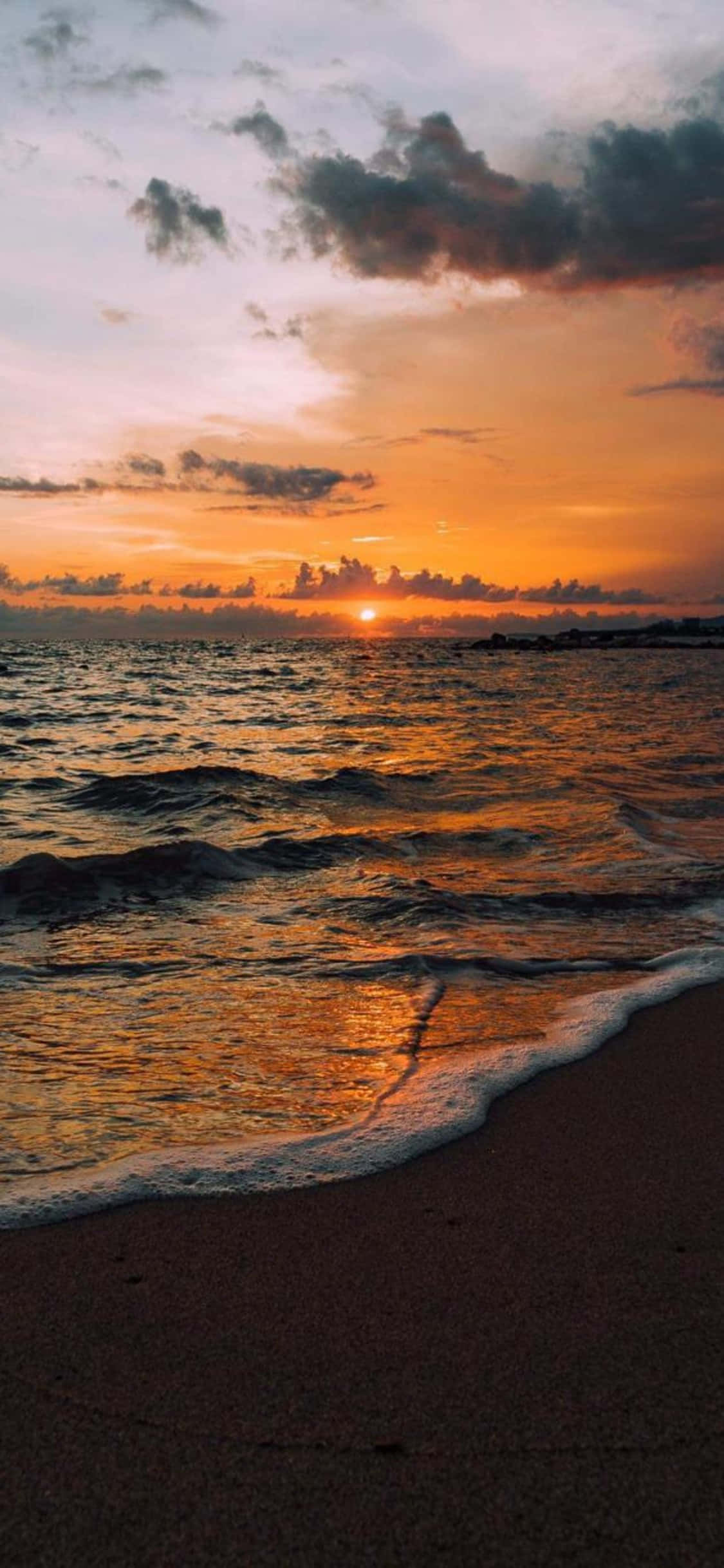 ภาพพื้นหลังชายหาดสงบบนจอ iPhone X วอลเปเปอร์