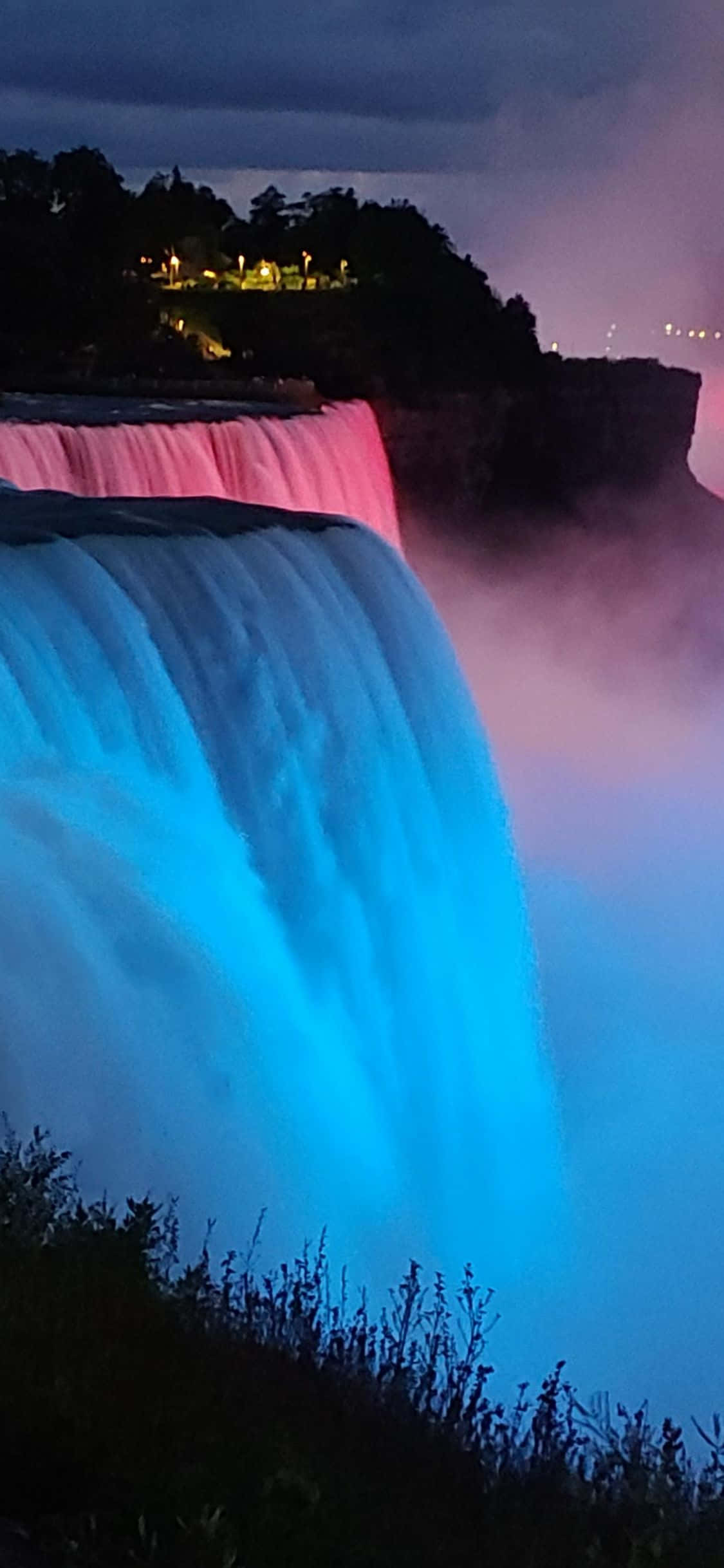 พื้นหลังน้ำตกไนแองการาแสงสีฟ้าสำหรับ iPhone X วอลเปเปอร์