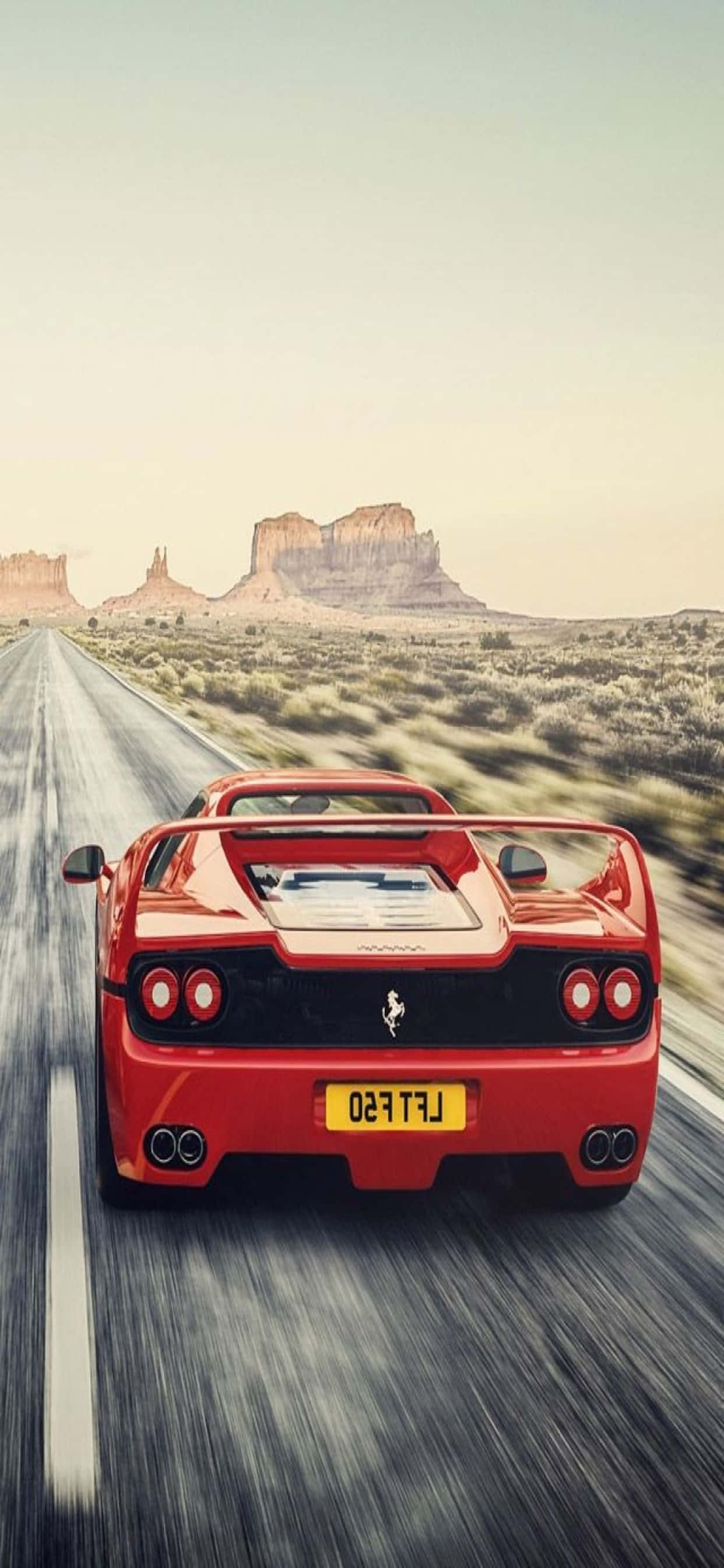 iPhone Xs Max Ferrari พื้นหลัง แดง Ferrari F50 บนถนน วอลเปเปอร์