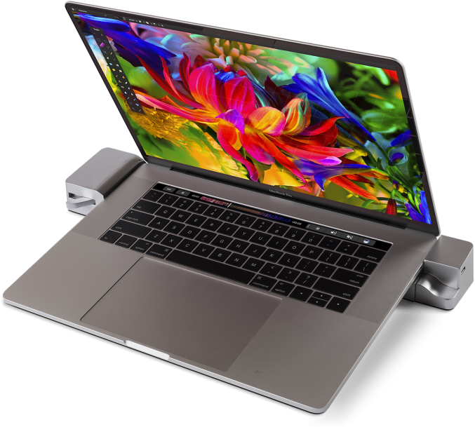 MacBook Pro พร้อมหน้าจอสีสันสดใสและอุปกรณ์เสริม วอลเปเปอร์