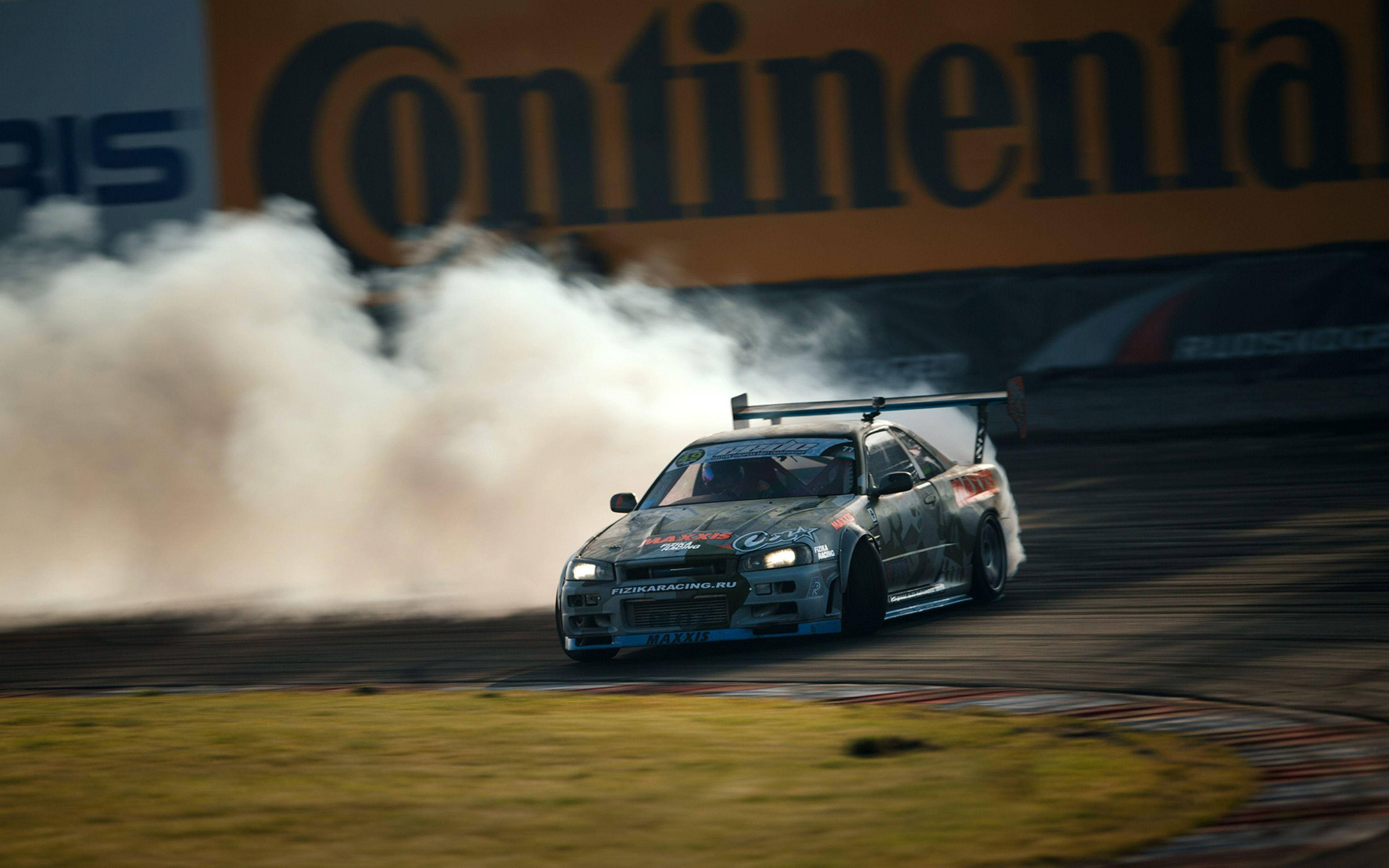 ดริฟท์รถ Nissan Skyline GTR R34 วอลเปเปอร์