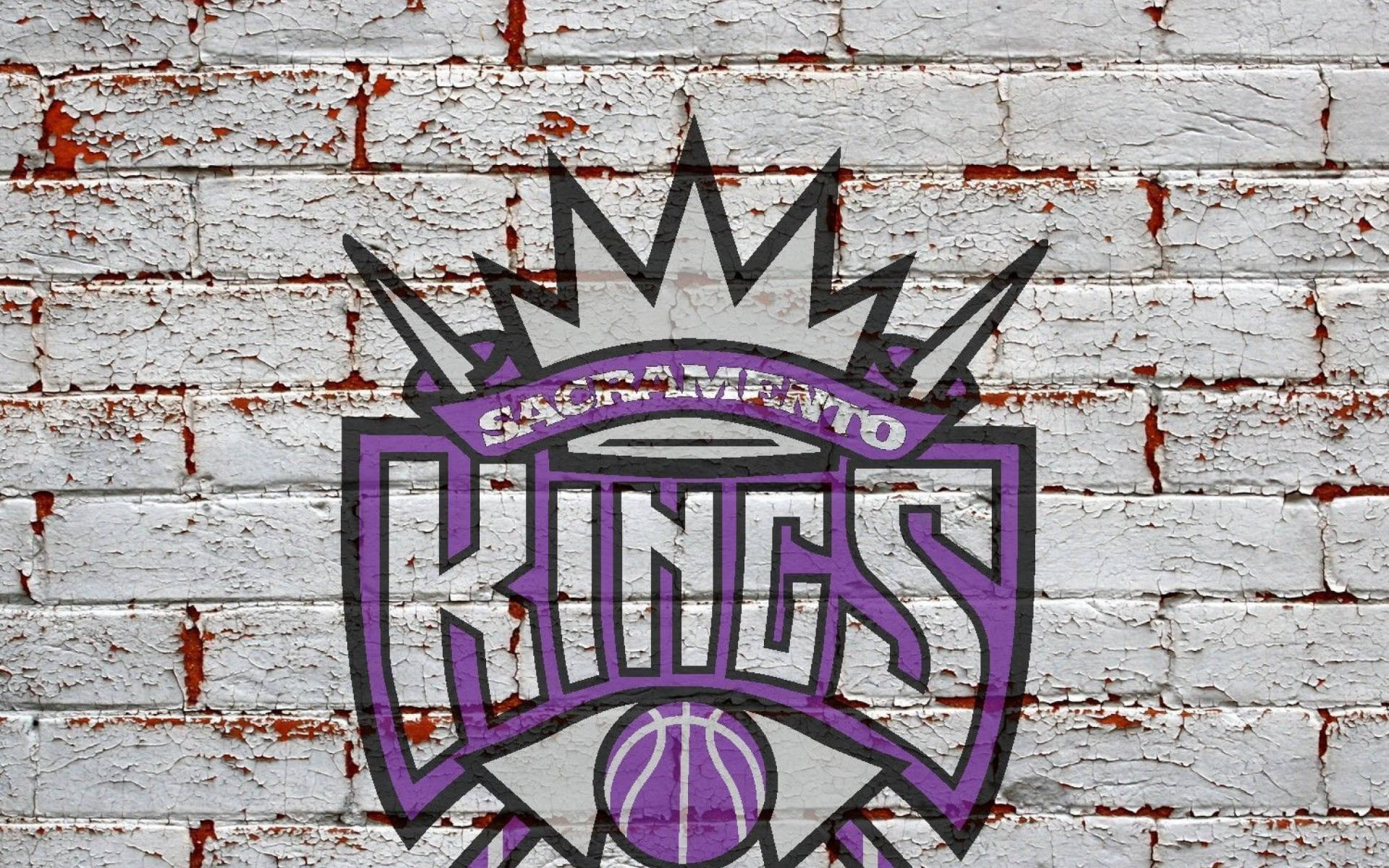 โลโก้ Sacramento Kings บนกำแพงอิฐ วอลเปเปอร์