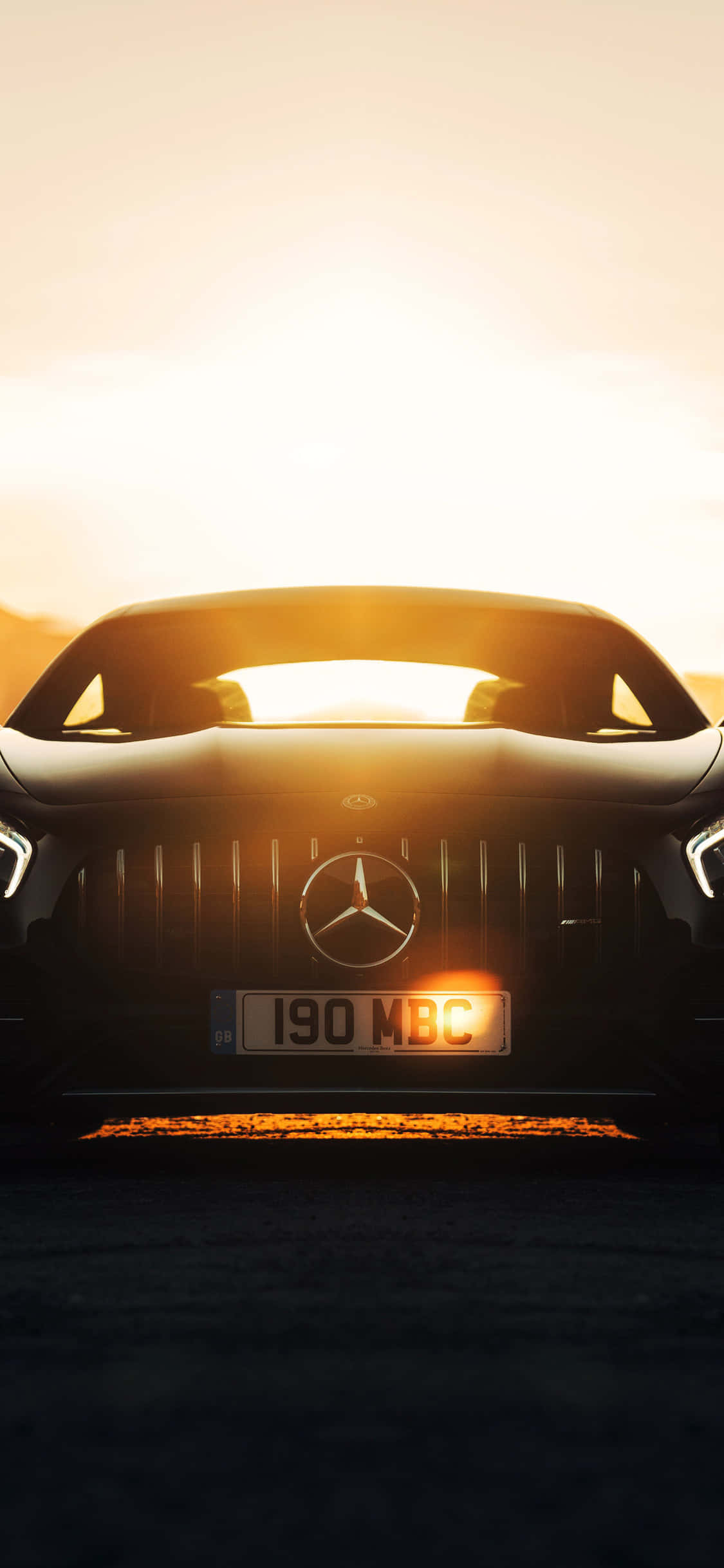 วอลเปเปอร์ iPhone X AMG GT-R ท่ามกลางแสงแดด วอลเปเปอร์