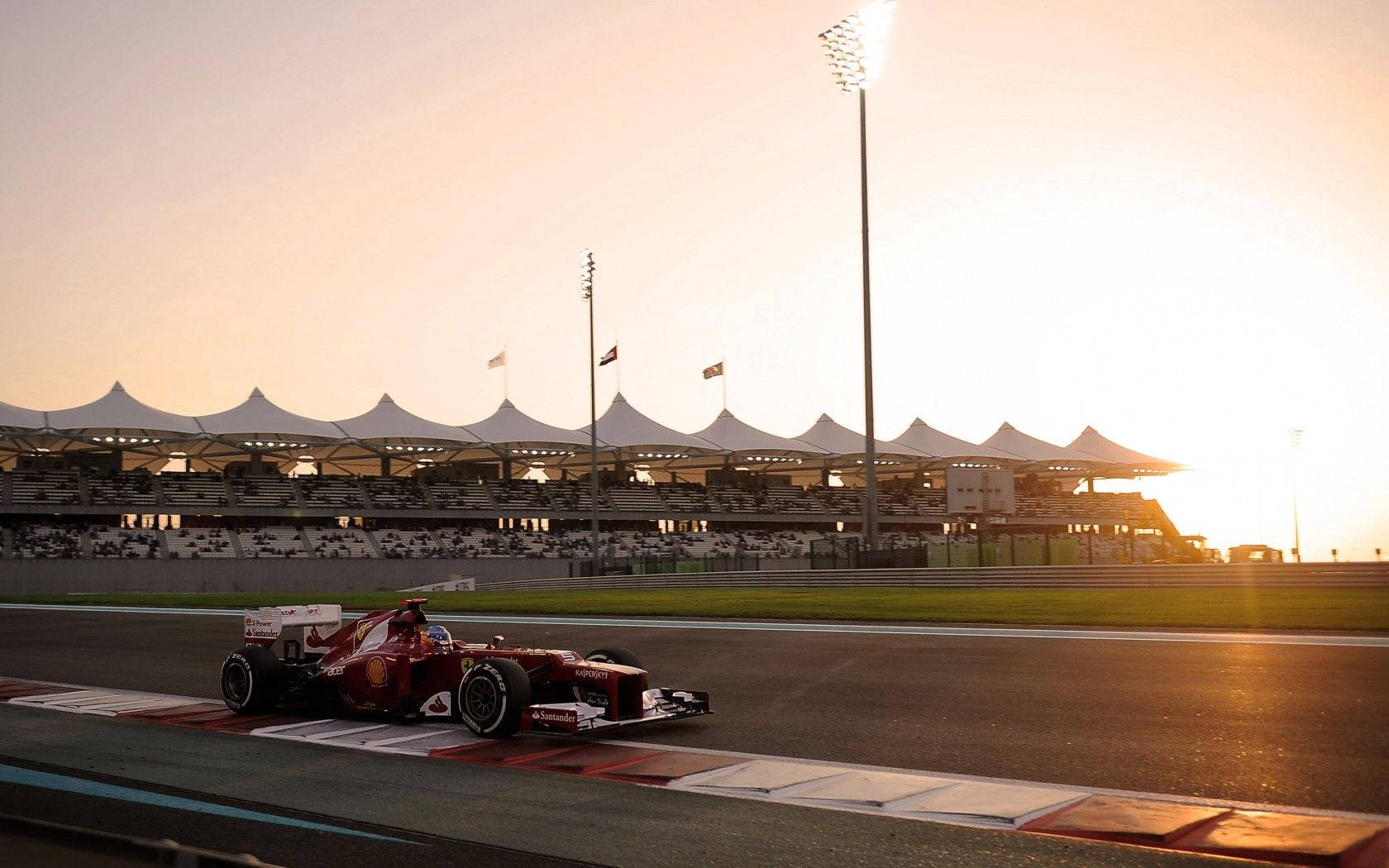 วอลเปเปอร์เดสก์ท็อป รถแข่งเฟอร์รารี Formula One พร้อมพระอาทิตย์ขึ้น — Ferrari วอลเปเปอร์