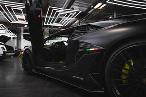 ประตูกรรไกรของรถสปอร์ตสีดำ — Lamborghini วอลเปเปอร์