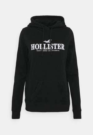 วอลเปเปอร์แจ็คเก็ตฮู้ดดำมินิมอลของ Hollister — สะอาด วอลเปเปอร์
