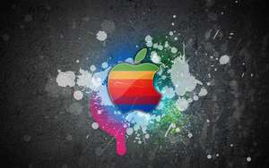 วอลเปเปอร์สีสันเท่ๆ ของโลโก้ Apple Macbook บนผนังสีเทาพร้อมรอยสีกระเด็น