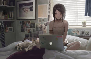 สาวอนิเมะทำงานกับแล็ปท็อปบนเตียง